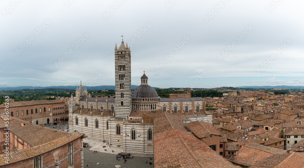 Panoramic view on cathedral with dome and bell tower in Siena - Italy.