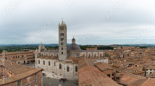 Panoramic view on cathedral with dome and bell tower in Siena - Italy.