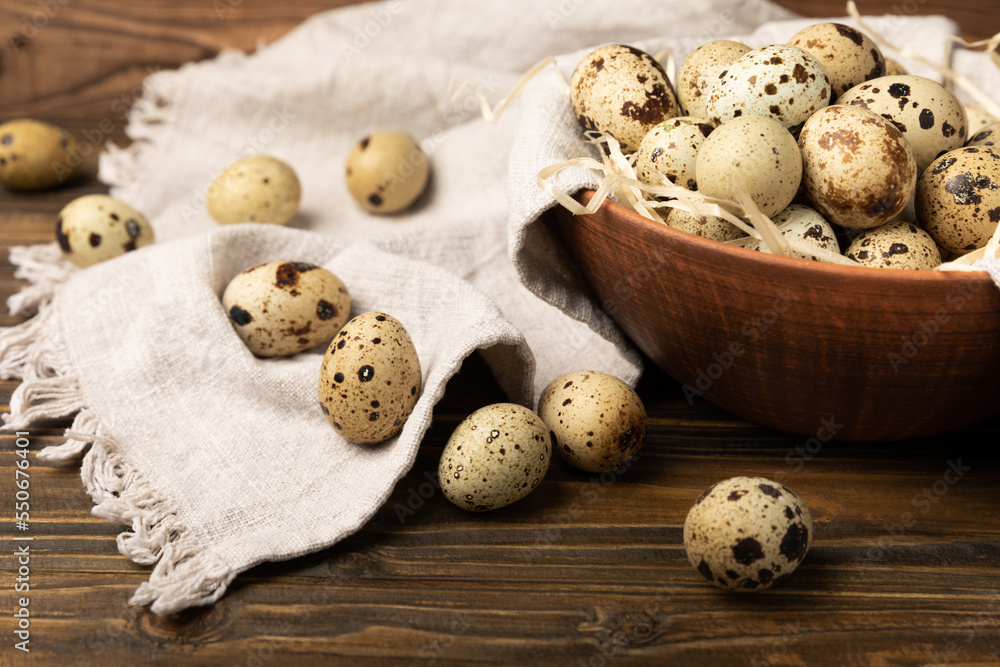 Quail eggs in a plate on a dark old brown wooden background. Eco product. Diet food. Healthy food. Space for text.Space for copy. Quail eggs in a plate on a dark old brown wooden background. Eco product. Diet food. Healthy food. Space for text.Space for copy.