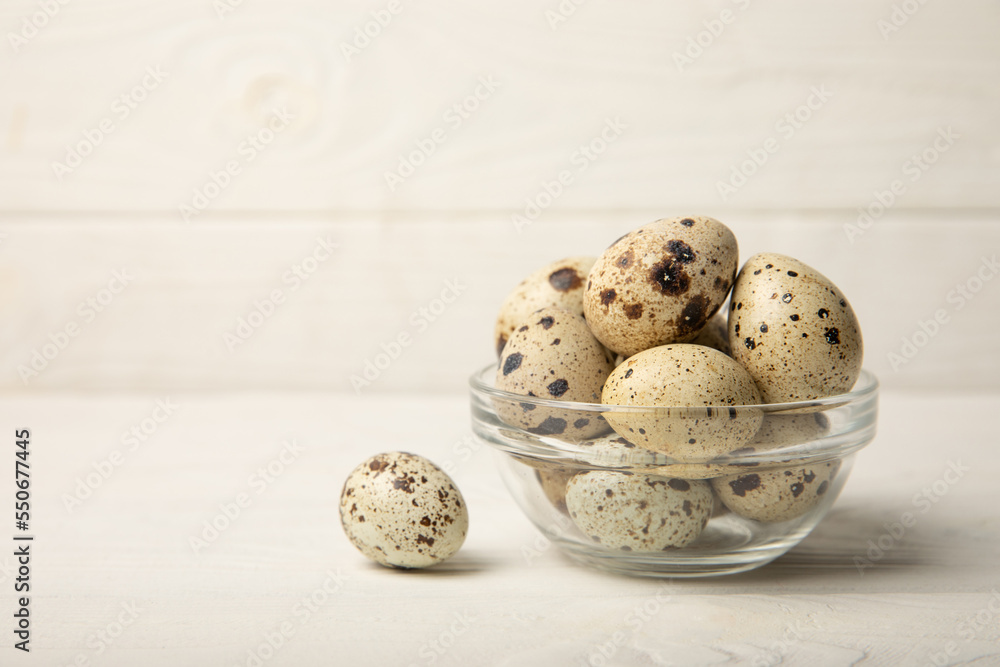 Quail eggs in a plate on an old white wooden background. Eco product. Diet food. Healthy food. Space for text.Space for copy. Quail eggs in a plate on an old white wooden background. Eco product. Diet food. Healthy food. Space for text.Space for copy.