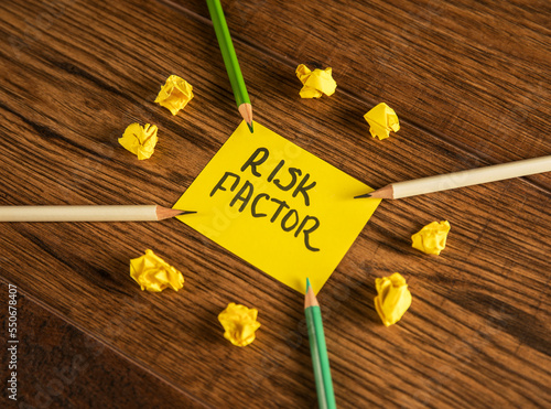 The inscription on paper Risk factor and pencils