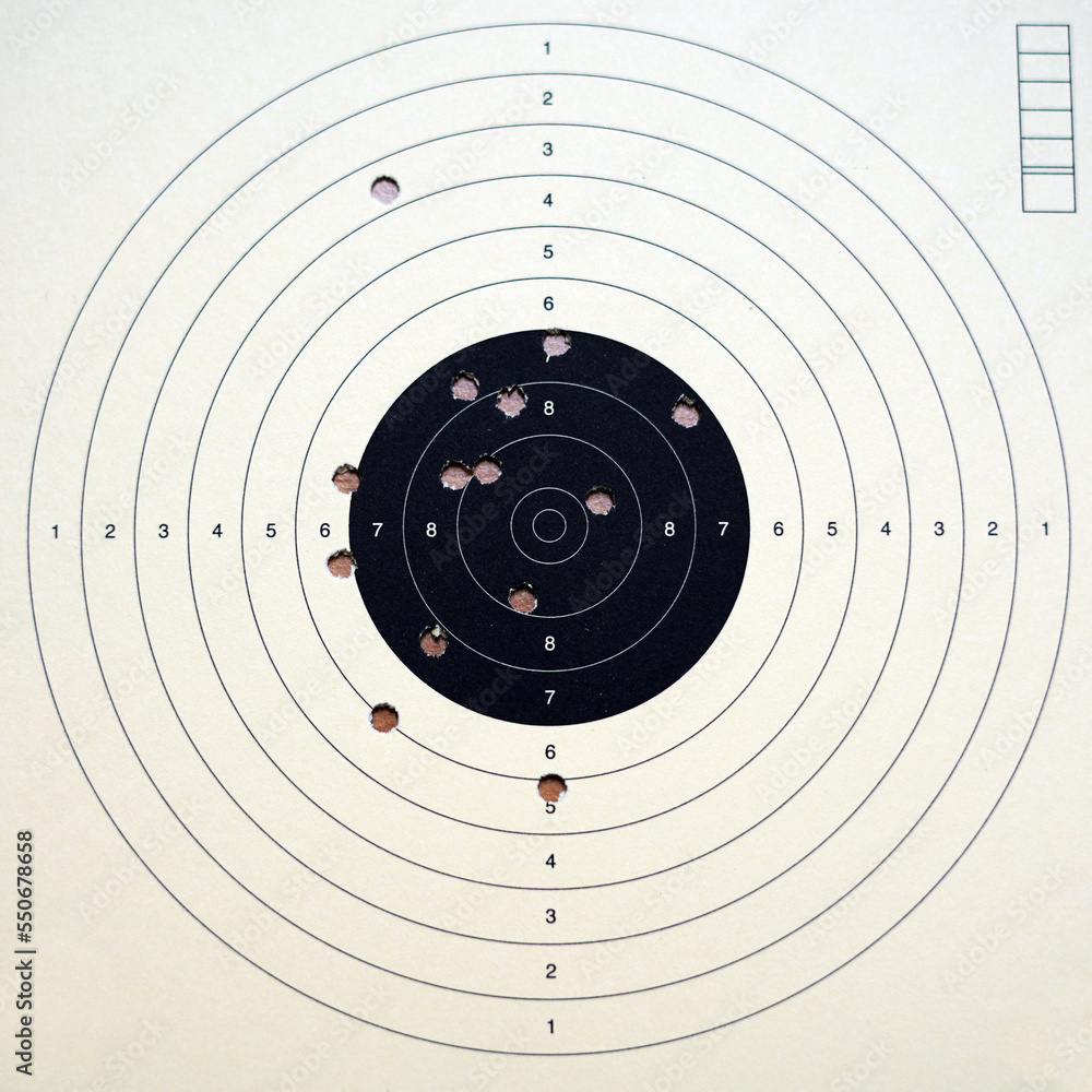 Paper target for firearms. We see several hits. Paper target for firearms. We see several hits.