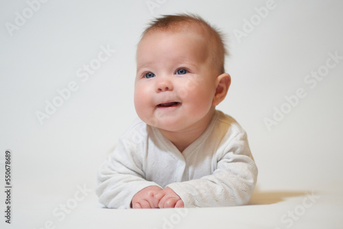portrait of a smiling baby on a white background