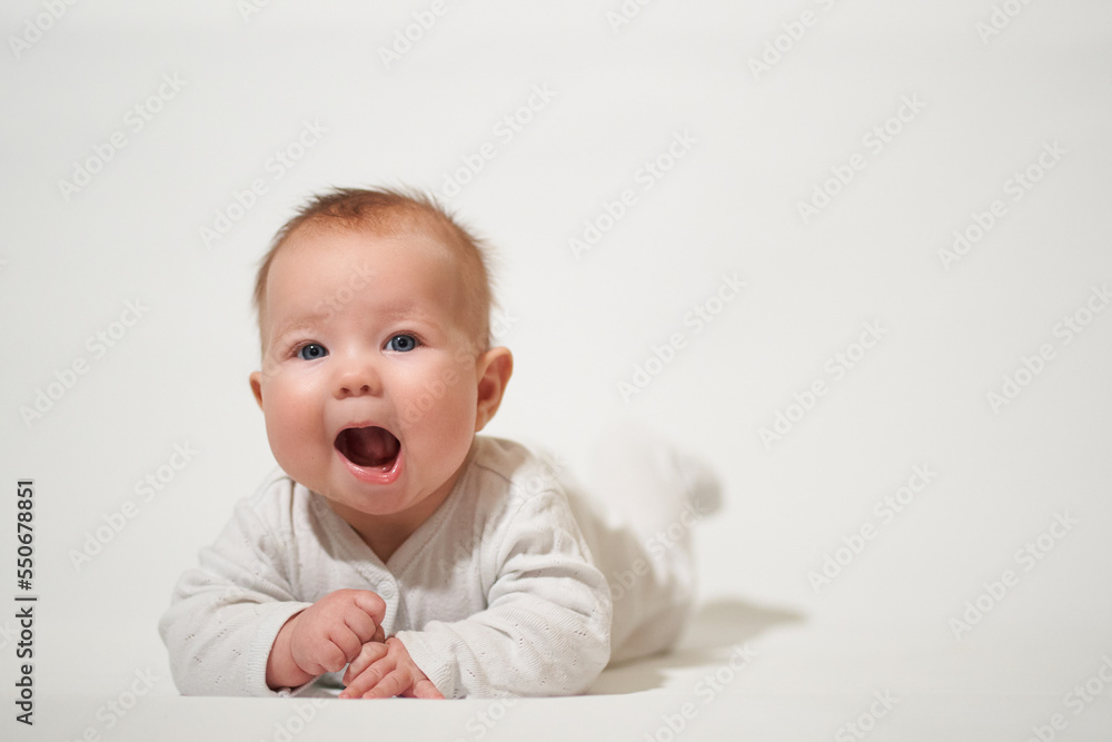 portrait of a smiling baby on a white background portrait of a smiling baby on a white background