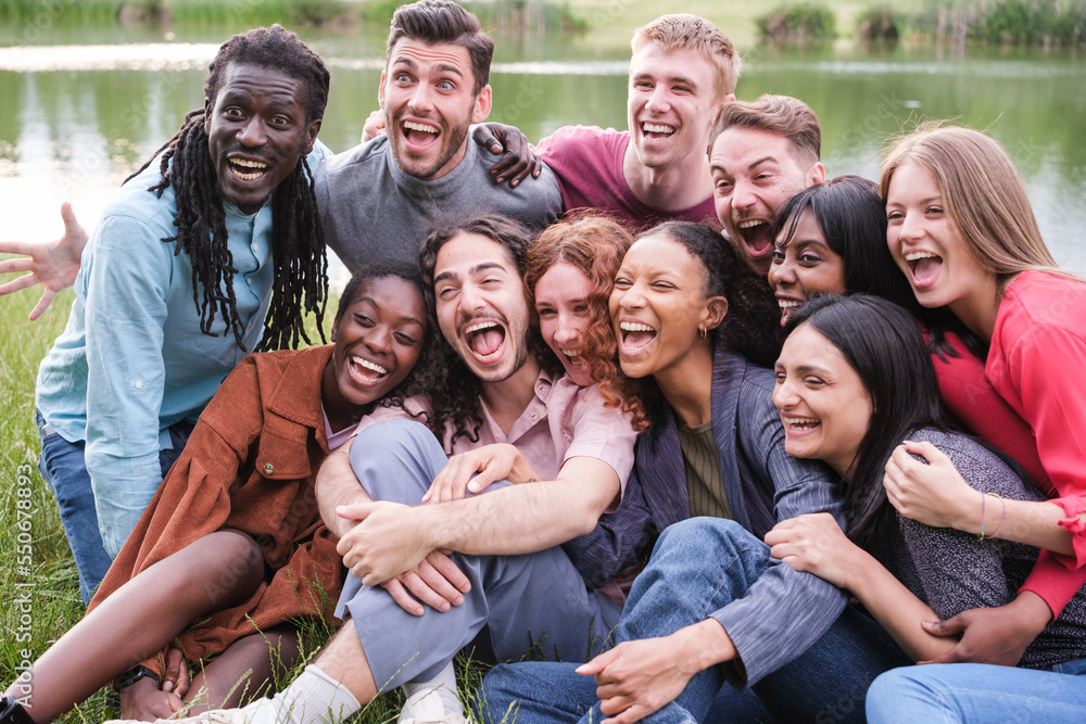 Group of friends from different cultures shouting and with funny faces having a joyful time Group of friends from different cultures shouting and with funny faces having a joyful time