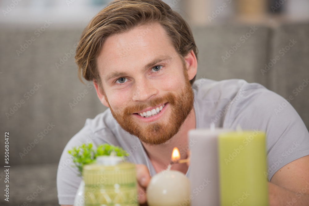 man is lighting candles for romance man is lighting candles for romance