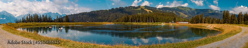 High resolution stitched panorama with reflections at the famous Schmittenhoehe summit, Zell am See, Salzburg, Austria