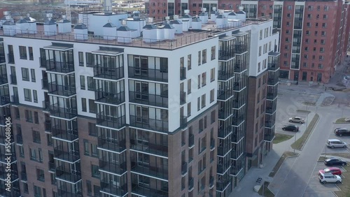 View from the height of the modern facade of the residential complex in the summer. A new apartment building with a modern design photo