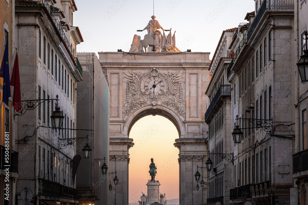 Rua Augusta Arch at sunset with King Dom Jose I Statue on background - Lisbon, Portugal