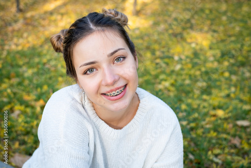 teenage girl with braces smiling