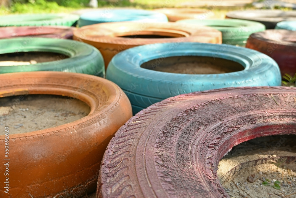 Colorful rubber wheels on the playground. Colorful rubber wheels on the playground.