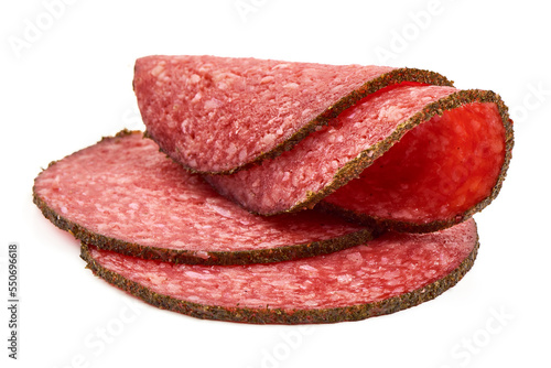 Sliced Salami with spices, isolated on white background.