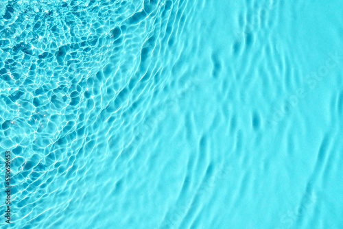 Sunny blue water texture background.