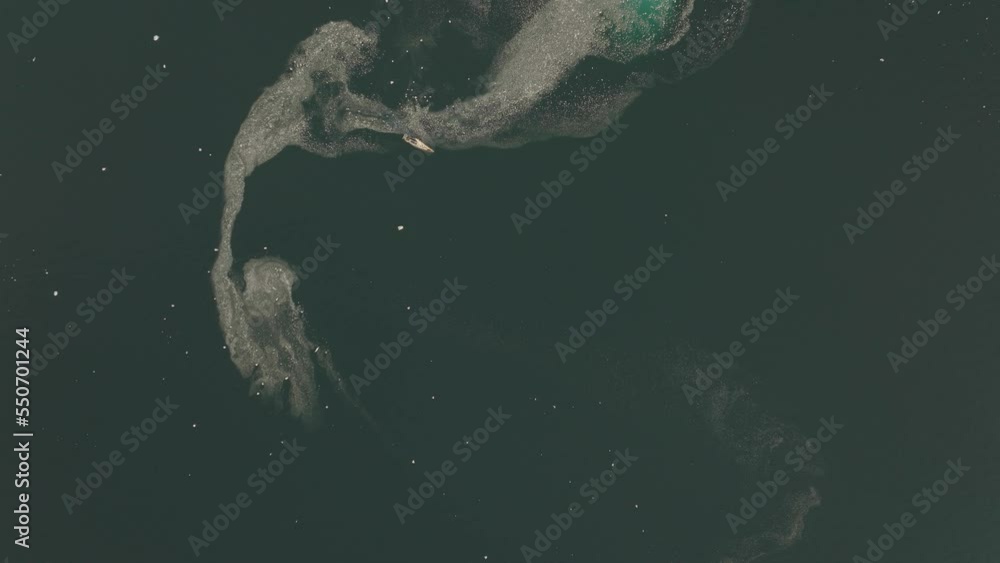 Aerial view of a big ice formation along the coast in a fjord at sunset, Sermersooq, Greenland. Aerial view of a big ice formation along the coast in a fjord at sunset, Sermersooq, Greenland.