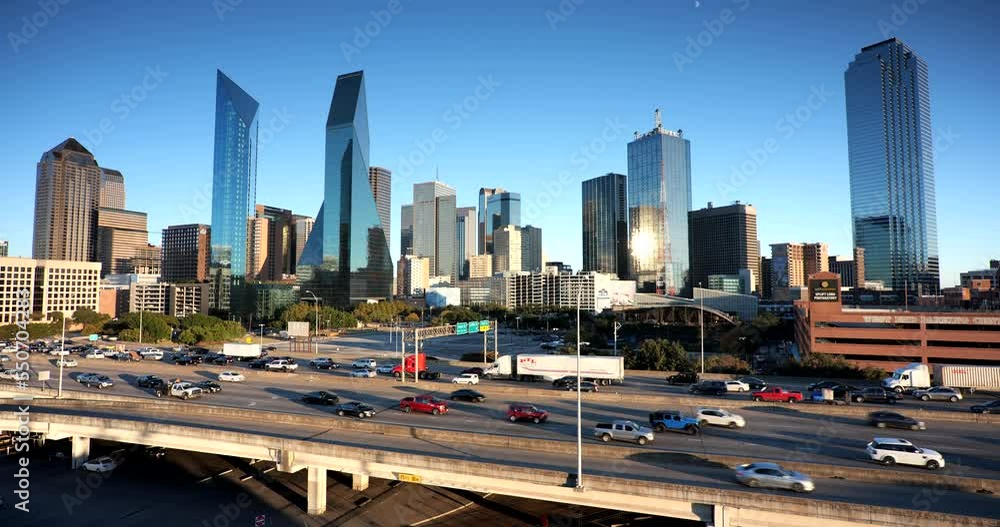 Downtown city skyline view of the modern financial district buildings over the traffic on the highway in Dallas Texas USA Downtown city skyline view of the modern financial district buildings over the traffic on the highway in Dallas Texas USA