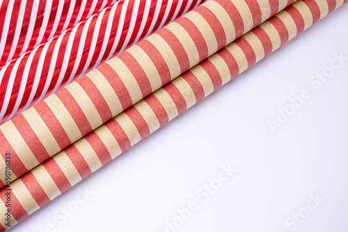Red and white and craft guft wrapping paper rolls in white background with copy space . photo