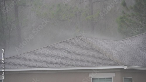 Thunderstorm above a house roof