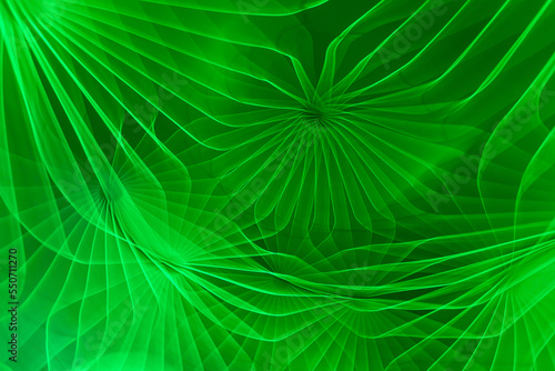Abstract green lit vivid pattern, photograph created with slow shutter speed and camera rotation