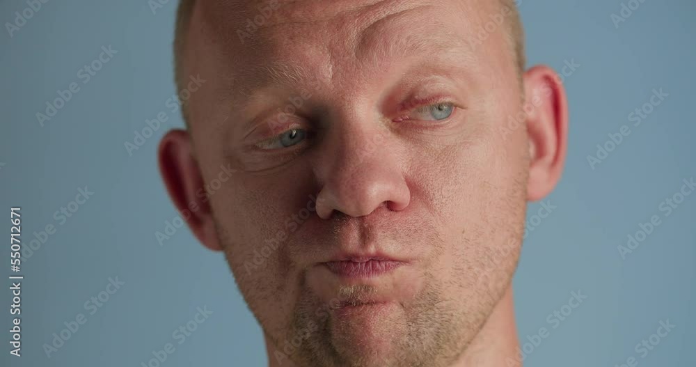 Close up video of thinking man, studio shot Close up video of thinking man, studio shot