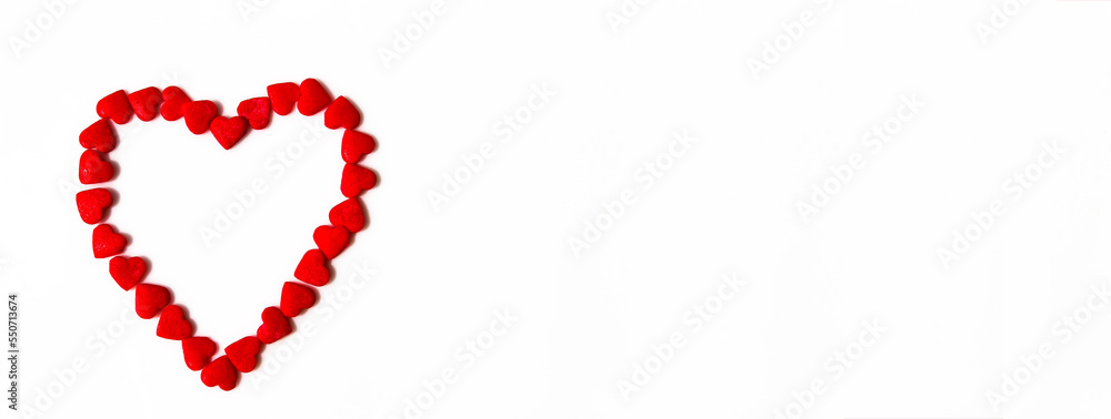 Banner of red hearts forms a heart shape on a white background. Isolated heart shape. The concept of love and romance. Romantic background composition. Valentine's Day