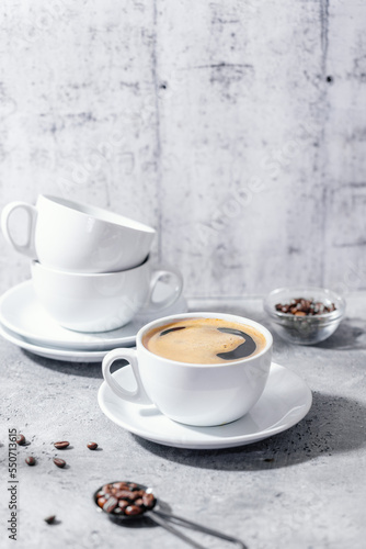 Cup of coffee on table on grey background