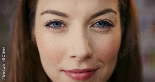 Face macro, woman or beauty for makeup, skincare and wellness with mystery, smile and natural eyes. Zoom portrait, happy model and cosmetics for skin care, health and smirk by blurred background