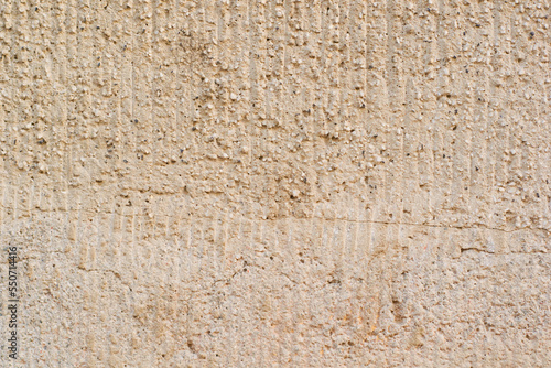 Old wall grange background texture, vintage surface, for design decoration. Old beige concrete wall.