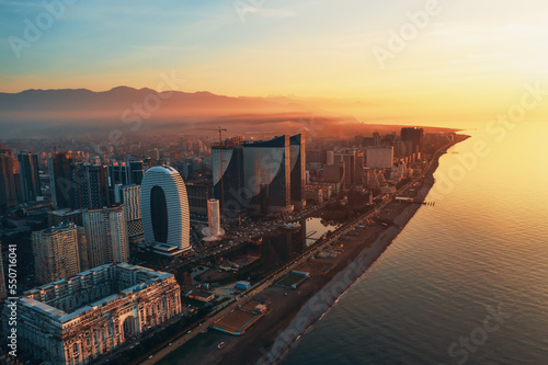 Aerial view of Batumi, Adjara, Georgia. Modern skyscrapers and hotels on coastline at sunset over Black Sea. photo