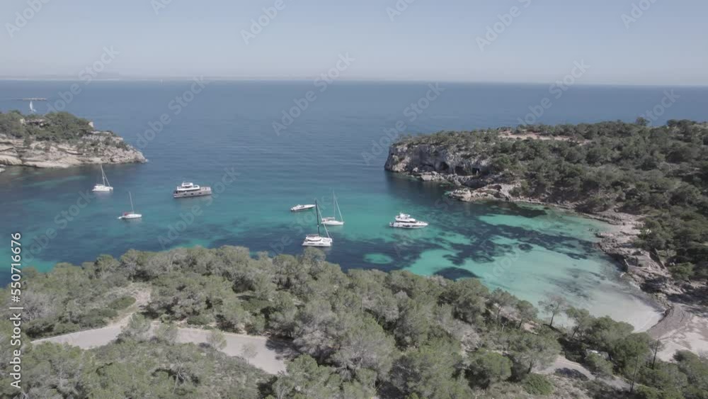 Panoramic of Portals Vells beach and inlet in Mallorca Island Spain, Mediterranean Sea with yachts and sailboats, Aerial pan right reveal shot Panoramic of Portals Vells beach and inlet in Mallorca Island Spain, Mediterranean Sea with yachts and sailboats, Aerial pan right reveal shot