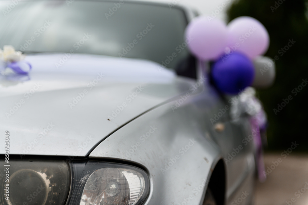 Car decoration for a wedding. Decorations on the car of the newlyweds. Cortege at the wedding Car decoration for a wedding. Decorations on the car of the newlyweds. Cortege at the wedding