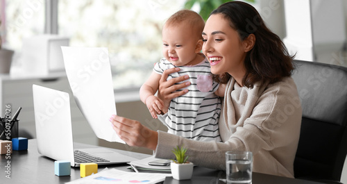 Happy working mother with h...