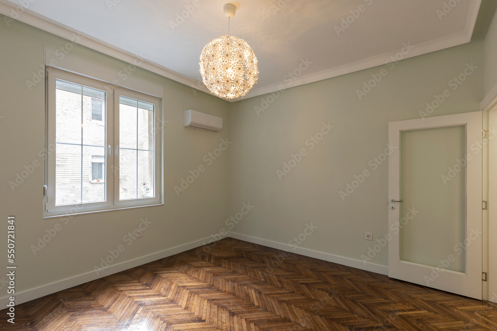 Interior of an empty apartment with brown wooden parquet Interior of an empty apartment with brown wooden parquet