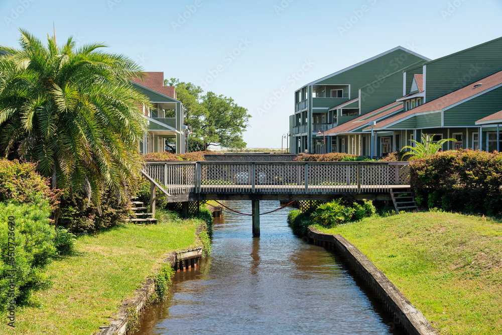 Fototapeta premium Destin, Florida- Small business plaza near the beach with bridges over the creek in the middle