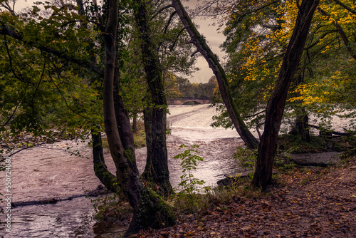 Walking along the river Derwent in autumn, view of Calver weir and new bridge, Derbyshire, England photo