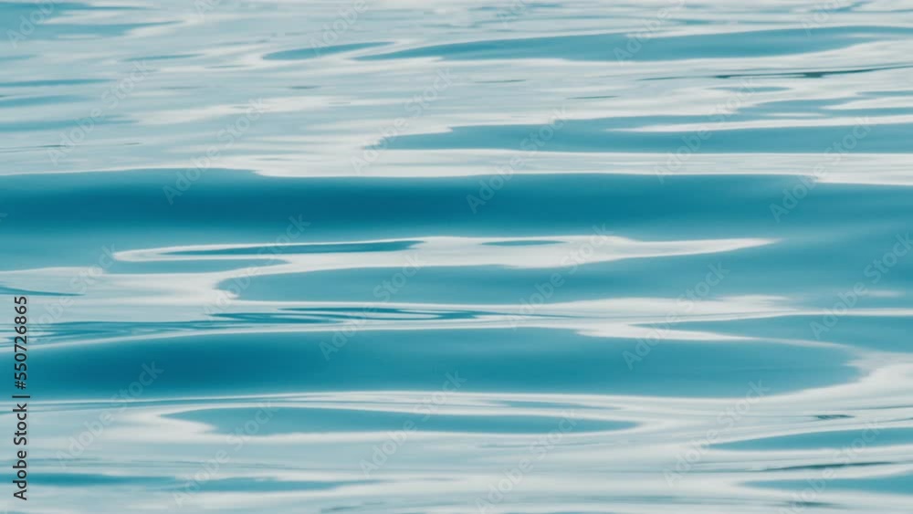 Calm sea surface with gentle waves and ripples Calm sea surface with gentle waves and ripples