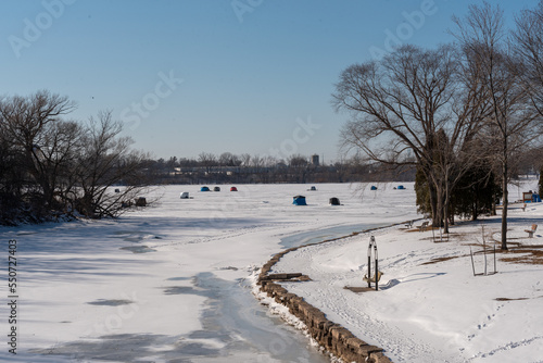 Ice Fishing On Fox River In De Pere, Wisconsin, In February photo