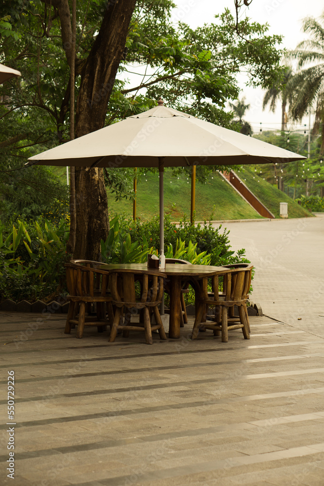Table chairs and umbrella 