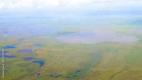 Flight over Chukotka. Seaside plain with Arctic prairie (wet tundra) and a huge number of melting, thermokarst, floodplain oxbow (bayou), lagoon ( coastal) lakes. Chukotka photo