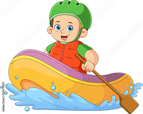 A boy rafting adventure using safety helmet and holding paddle
