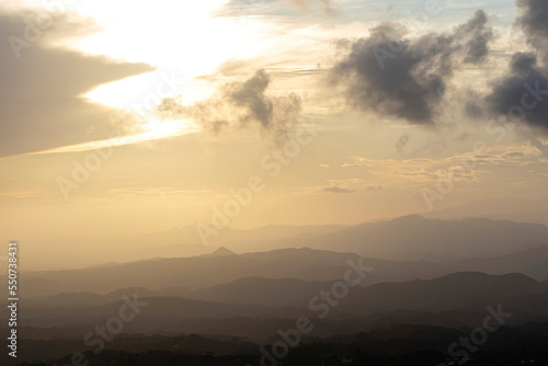 View of a beautiful golden sunset over a mountain range © cratervalley