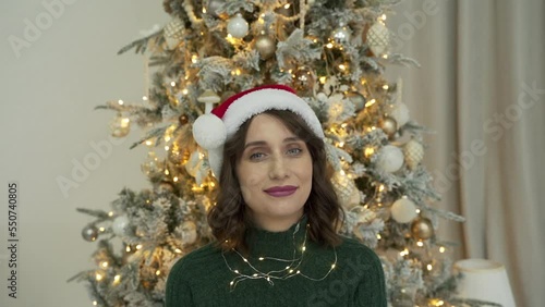 woman calls her friends via video conference call wishing Merry Christmas