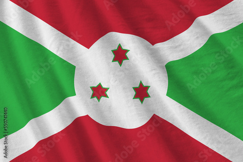 Burundi flag with big folds waving close up under the studio light indoors. The official symbols and colors in fabric banner photo