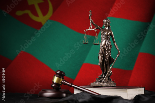 Transnistria flag with statue of lady justice, constitution and judge hammer on black drapery. Concept of judgement and punishment