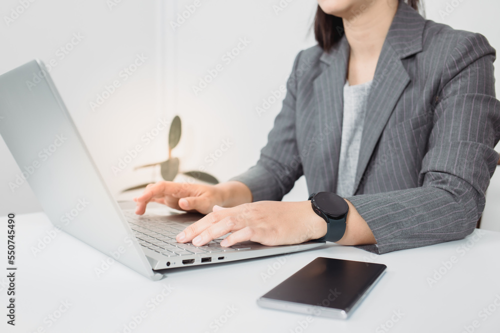 business woman looking the laptop or Notebook computer, personal working with laptop in the home office. business woman looking the laptop or Notebook computer, personal working with laptop in the home office.