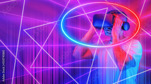 man wearing 3D goggle heatset overlay with neon light circle and lines in concept of cyberspace with virtual reality world