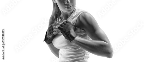 Fitness woman in sports clothing showing her well trained body Black and white close-up portrait Isolated on white