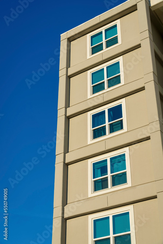 Building exterior with square paned windows in a low angle view at Destin, Florida
