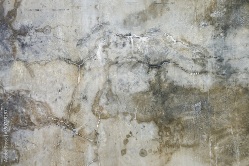 The cement flap surface has scratches, black and white stains, traces caused by plastering to create an artistic pattern
