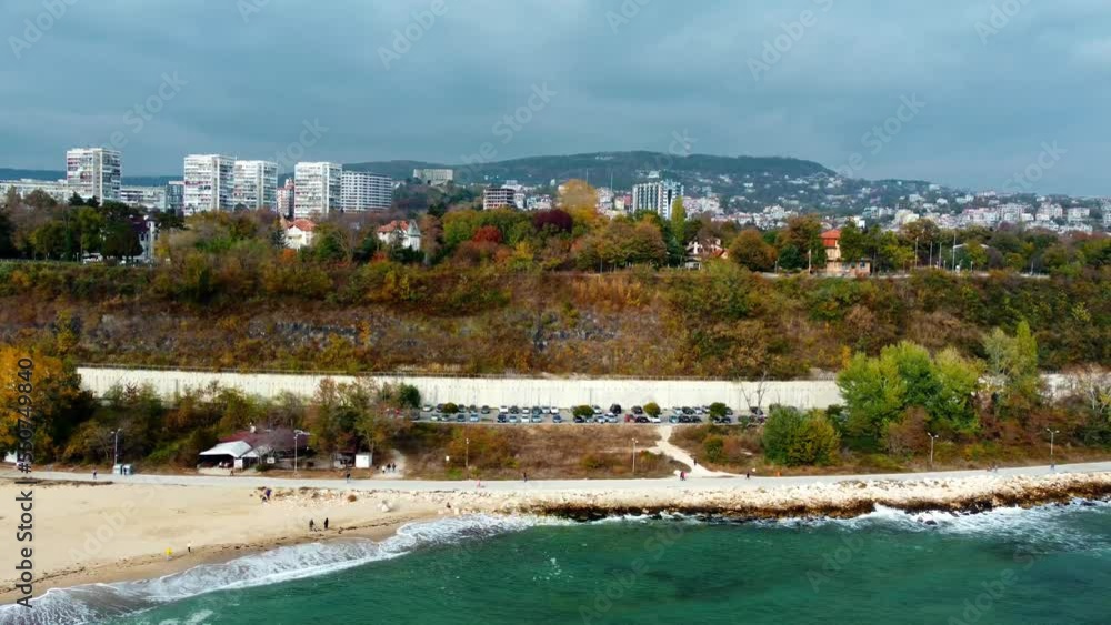 Side aerial view of Varna's coastline and promenade with the city in the background Side aerial view of Varna's coastline and promenade with the city in the background