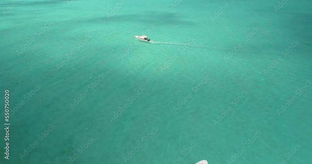 Aerial zenith view two motor boats stand in the middle of the caribbean sea turquoise water, Los roques. Aerial zenith view two motor boats stand in the middle of the caribbean sea turquoise water, Los roques.